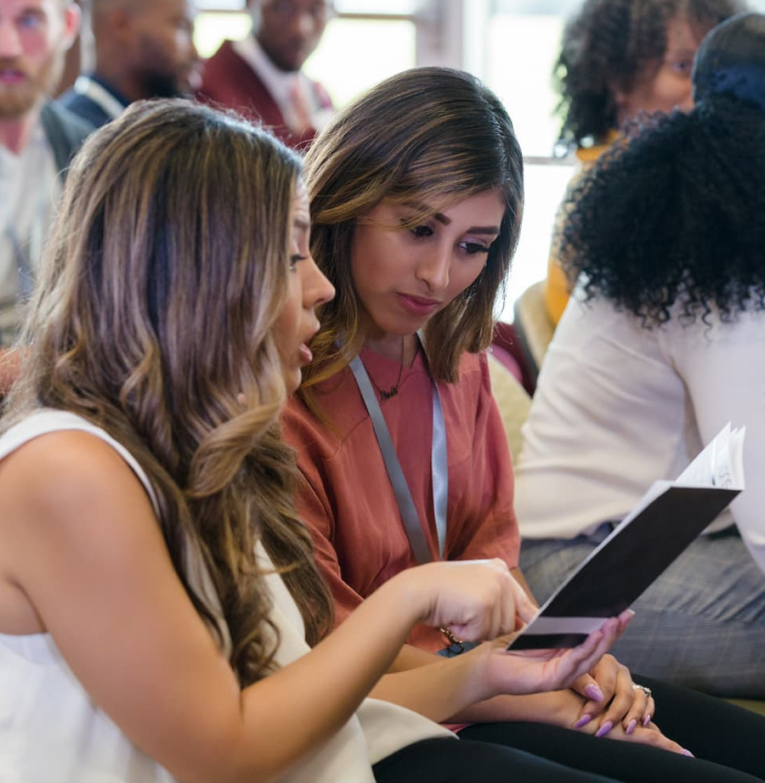 Foundation LAEF Annual Member Meeting Two Girls Looking At Notes